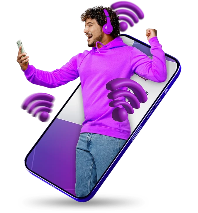 A man in a purple sweatshirt holds a phone with a matching wireless earphone